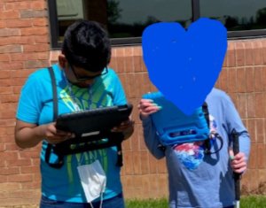 Jonathan and friend communicating with their devices